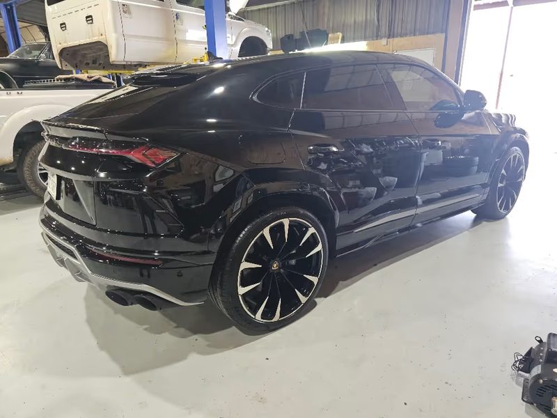 Black crossover polished and reassembled after paint work